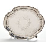 A George III teapot stand, by Solomon Hougham, London 1795, shaped oval with engraved cartouche,