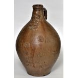 18th Century German salt glaze Bellarmine jug, of typical bulbous form,