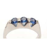 A sapphire and diamond ring, three circular facet cut sapphires part collet set,