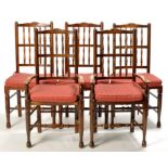 A set of twelve stained beech country style dining chairs, to include: two carvers and ten singles,