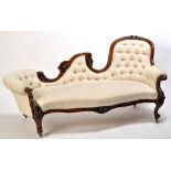 A Victorian carved mahogany chaise longue,