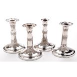 Four Victorian candlesticks, by Harrison Bros.