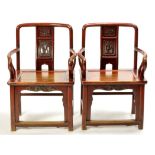 A pair of Chinese red stained hardwood chairs,