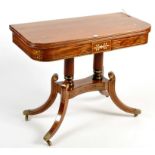 A Regency mahogany and brass inlaid turnover top tea table,
