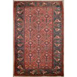 A Bijar rug, decorated with stylised floral motifs on a claret field, floral patterns to border,