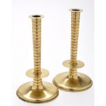 A fine pair of Charles II brass 'trumpet based' candlesticks,