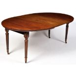 An early 19th Century style mahogany extending dining table,