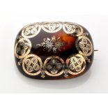 A yellow and white metal inlaid tortoiseshell piquet work brooch,