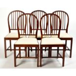A set of six late George III style mahogany dining chairs,