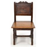 An 18th Century and later carved oak hall chair,