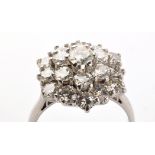 A diamond cluster ring, the brilliant cut diamonds set in three tiers, approximately 3.