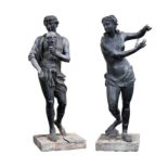 A pair of near life size semi nude male and female lead figures in the manner of John Cheere,