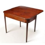 A late George III mahogany turn-over-top tea table, with rounded edge above plain frieze,