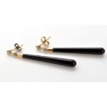 A pair of onyx and diamond drop earrings,