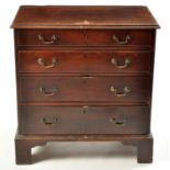 A George III mahogany chest of four long graduated drawers,