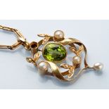 An Edwardian peridot and seed pearl drop pendant, the central oval facet cut peridot millegrain set,