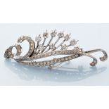 A diamond set floral spray pattern brooch/pendant, set throughout with eight-cut diamonds to leaves,