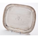A George III waiter, by William Bennett, London 1810, rounded rectangular with gadrooned rim,