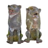 Two Chinese terracotta dogs of foe garden ornaments, each with open mouths and scale manes,