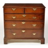 A George III and later chest of two short and three long graduated drawers,
