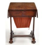 A Victorian goncalo alves work table, the rectangular top with two drop leaves,