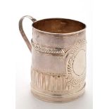 A Queen Anne Britannia Standard small mug, by John Cory, London 1705, with fluted scroll handle,