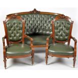 A Victorian walnut three-piece salon suite, comprising: settee and two open arm easy chairs,