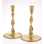 A pair of 18th Century brass candlesticks,