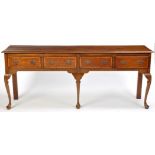 An 18th Century style oak dresser, the rectangular top with crossbanded and moulded edge,