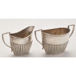 A late Victorian two-handled sugar bowl and matching milk jug, by Barker Bros.