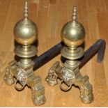 A pair of 19th Century brass andirons, with spire finial above sphere,