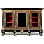 A late 19th Century ebonised breakfront credenza, decorated with applied ormolu moulding, corbels,