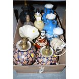 A collection of vases and miscellaneous table lamps.