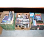 A large collection of miscellaneous DVD's, including some box sets, in three boxes.