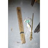 A quantity of brass stair rods; a brass poker; and stair rod clips.