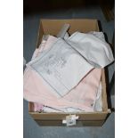 A collection of miscellaneous table linen, comprising: place mats; doilies; etc., in a box.