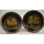 A pair of Chinese black lacquer bowls decorated with gilt figures on a terrace, 20th century, 21