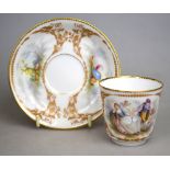 A 19th century continental porcelain teacup and saucer painted with figures and putti and gilt