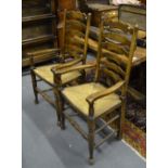 A set of eight 18th century style wavy ladderback chairs with rush seats (8)