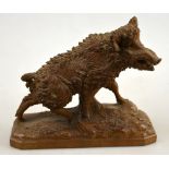 A Swiss Black Forest carved wood wild Boar, inscribed beneath 'Arosa 1938', 13 cm high 1 tusk broken