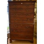 A George III mahogany chest on chest, the dentil moulded cornice over two short and six long