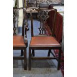 A set of eight Chippendale style mahogany dining chairs with shaped, pierced, vertical splats over