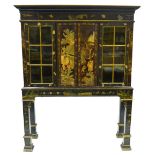 A 19th century Chinese black lacqured cabinet decorated overall with gilt and poychrome, the moulded