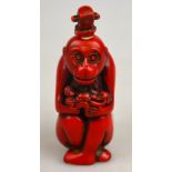 A Chinese red coloured hardstone snuff bottle and stopper in the form of a monkey, 8.5 cm One