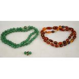 A green aventurine necklace to/w matching stud earrings and a graduated modern amber bead necklace