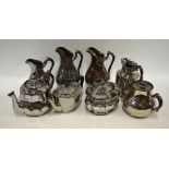 A collection of silver resist wares comprising three teapots, one sucrier and cover and four water