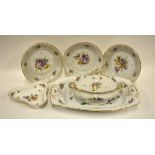 An extensive Tiefenfurt porcelain dinner service decorated in the Dresden style with polychrome