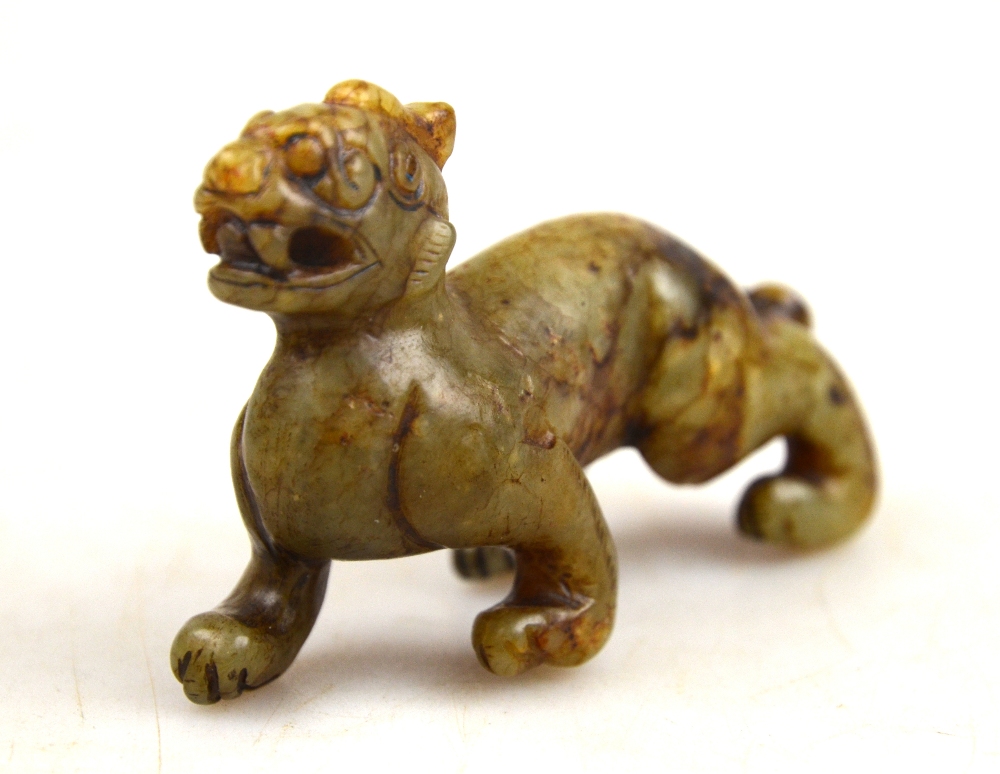 A Chinese nephrite jade carving a a fabulous animal, 7.5 cm long x 5.4 cm high