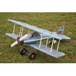 A large painted metal model bi-plane, 140 cm long, 150 cm wingspan