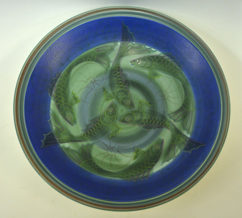 A Poole Pottery Studio circular dish decorated with a fish design by Sally Tuffin and painted by